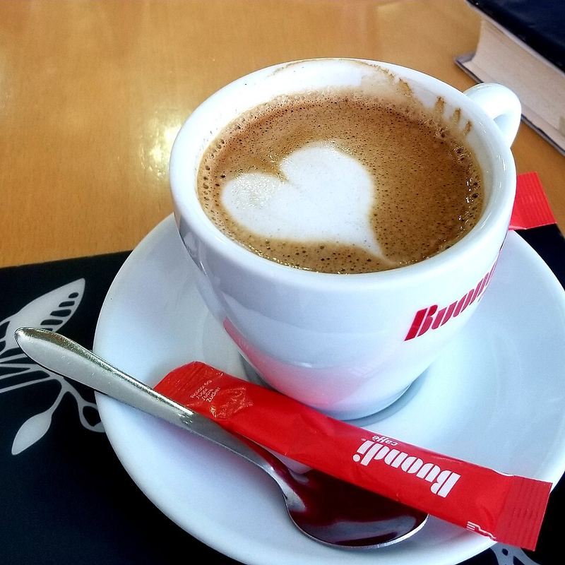 A cappuccino with a heart drawn in the foam (mood photo)